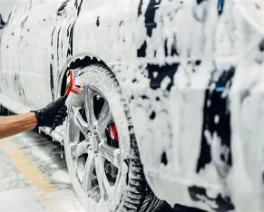 Crystal Car Detailing washing a wheel